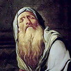 Tiresias with mustache and beard while wearing a blue hooded cloak