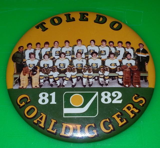 Toledo Goaldiggers Toledo Goaldiggers Home Stick amp Puck Logo Gold Hoodie Hockey