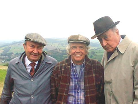 Tom Owen in the center wearing checkered long sleeves with Peter Sallis and Frank Thornton