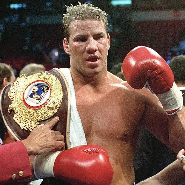 WBO heavyweight champion Tommy Morrison receives his championship belt after defeating George Foreman in Las Vegas