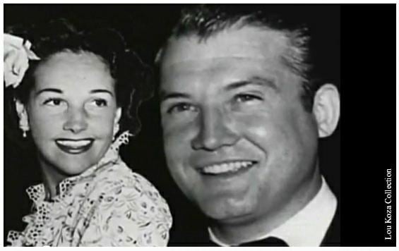 On the left, Toni Mannix smiling while, on the right, George Reeves also smiling and wearing a coat, long sleeves, and necktie