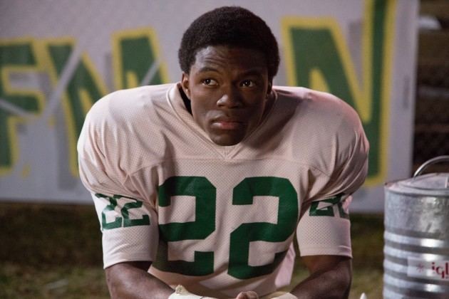 Caleb Castille as Tony Nathan looking afar and wearing a jersey in a scene from the movie "Woodlawn 2015".