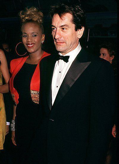 Toukie Smith's beautiful smile and Robert De Niro in his black coat, white long sleeves and bow tie