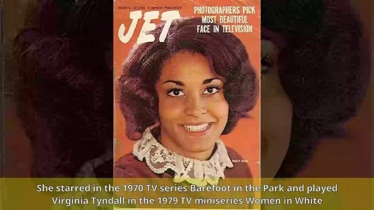 Tracy Reed featured in Jet Magazine while smiling and wearing a white and maroon blouse