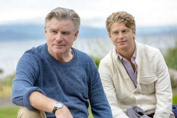 Treat Williams wearing blue sweatshirt and Andrew Francis wearing cream jacket and checkered polo in Chesapeake Shores (2016)