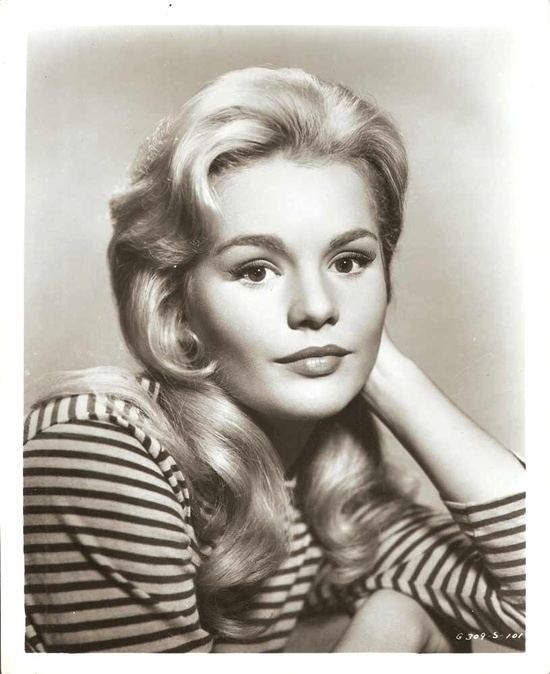 Actor Tab Hunter, left, with actress Tuesday Weld at a dinner