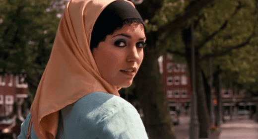 Yolanthe Sneijder-Cabau wearing beige hijab and blue dress in the film Turkse Chick (2006)