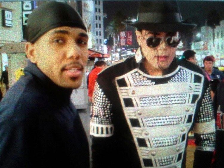 Michael Jackson's impersonator and Tyrone D. Burton who is wearing black beanie and black jacket