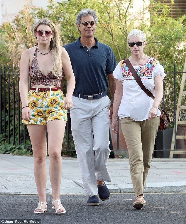 Annie Lenox walking with her husband Mitch Besser and daughter Lola Fruchtmann in west London while they are wearing sunglasses