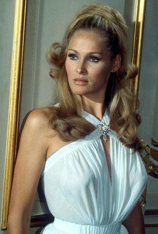 Ursula Andress as Honey Ryder wearing a white dress from a scene in Dr. No, 1967.