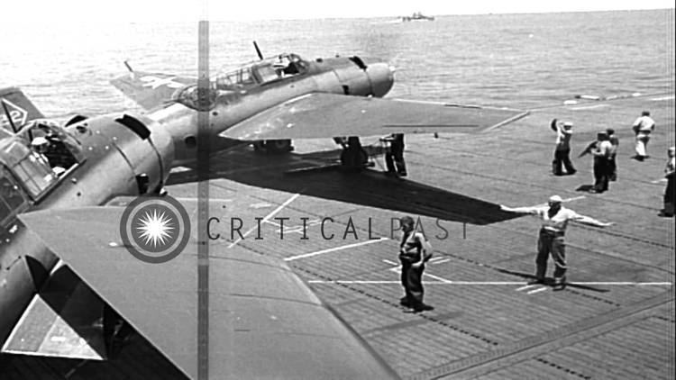 USS Marcus Island (CVE-77) TBF Avenger and F4F aircraft take off from USS Marcus Island CVE77