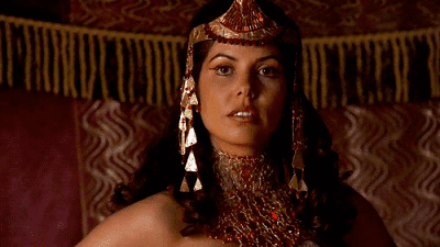 Vaitiare Hirshon as Sha'ren wearing a red and gold headdress and chocker in 1997 tv series, Stargate SG-1