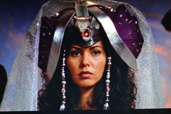 Vaitiare Hirshon wearing a purple and silver headdress and white veil in a scene from the 1997 tv series, Stargate SG-1