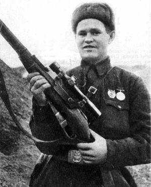 Vasily Zaytsev holding a sniper gun