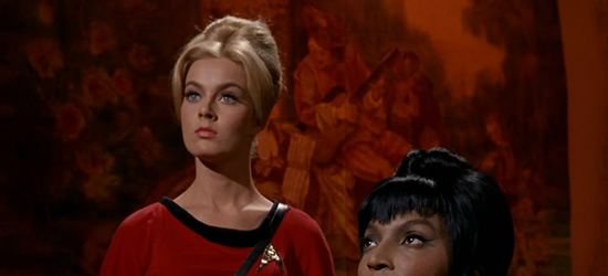 Venita Wolf as Yeoman Teresa Ross with her hair arranged and wearing a red space suit in a scene from Star Trek, 1966.