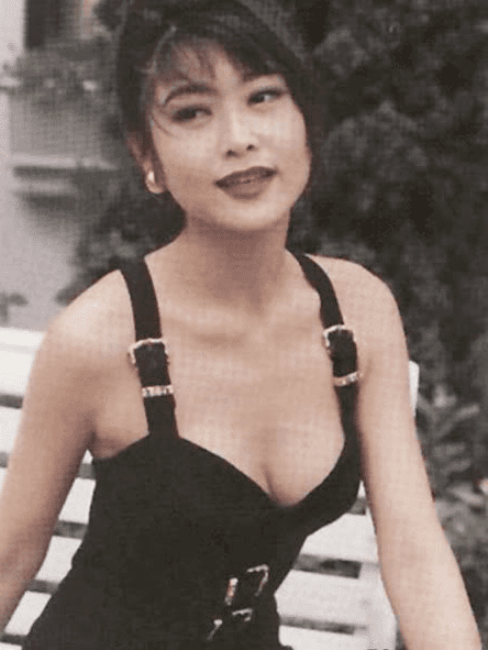 Veronica Yip smiling while wearing a black sexy dress