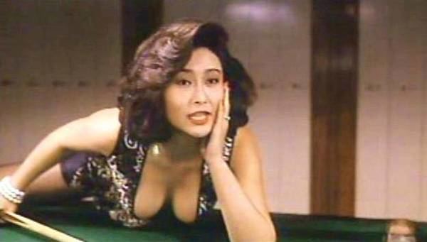 Veronica Yip talking while playing billiards and wearing a black sexy top