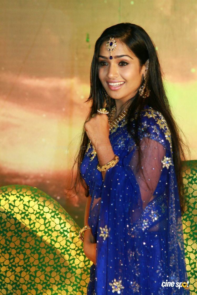 Vidhya Mohan wearing a blue Malayalam Dress