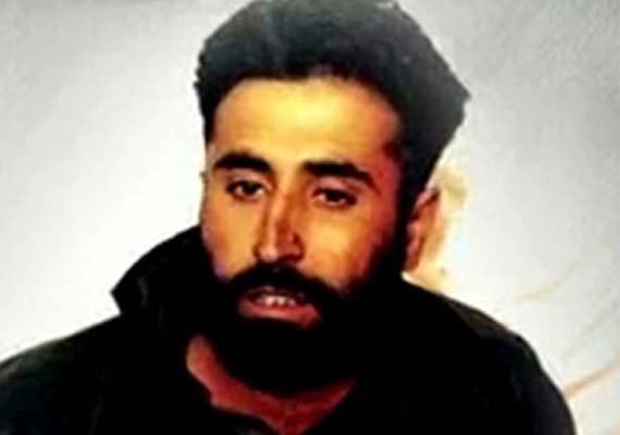 Vikram Batra being featured in a television show with a thick beard and wearing a black jacket.