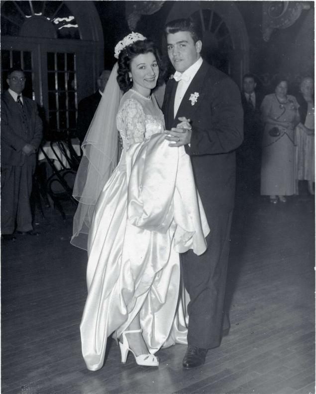 Vincent Gigante and Olympia smiling while dancing on their wedding day