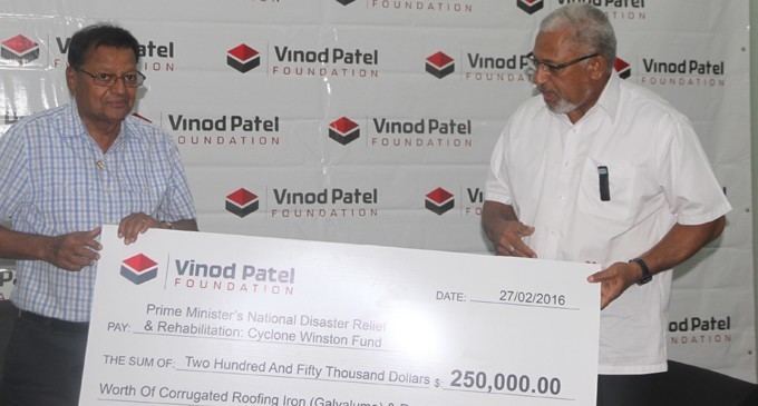 Vinod Patel Group Director and Foundation trustee, Bachubhai Patel handing over the cheque to the Prime Minister Voreqe Bainimarama at the Vinod Patel head office yesterday