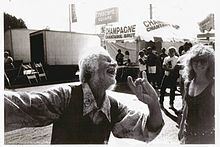Vito Paulekas is laughing at a street festival in Los Angeles, California, USA.