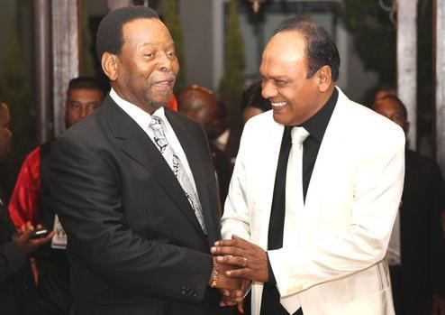 Vivian Reddy smiling while shaking hands with King Goodwill Zwelithini 
at his 60th birthday celebrations
