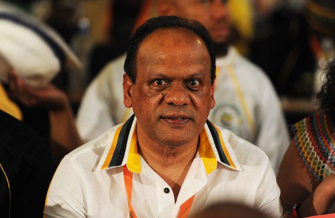 Vivian Reddy wearing a white and yellow polo with black lining