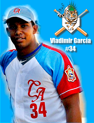 Vladimir García is smiling and has black hair, wearing a blue cap, a black jersey under a white with a blue and red jersey with a #34 on it, and a logo on his left arm jersey in an image with a logo of a baseball team and his name with #34