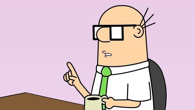 Comic strip and cartoon art featuring Wally holding a cup of coffee while sitting in a chair, wearing eyeglasses, white long sleeves, and a green tie.