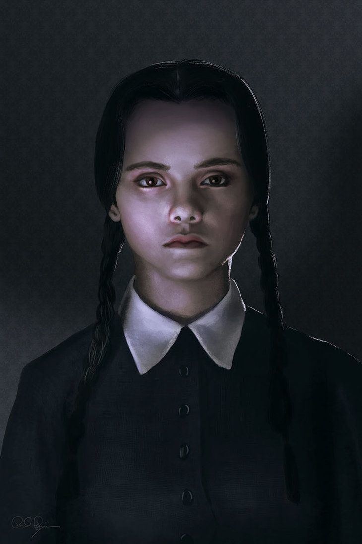 In black background with a shade of light, Wednesday Addams is serious, standing, has black hair wearing a white collar black dress.