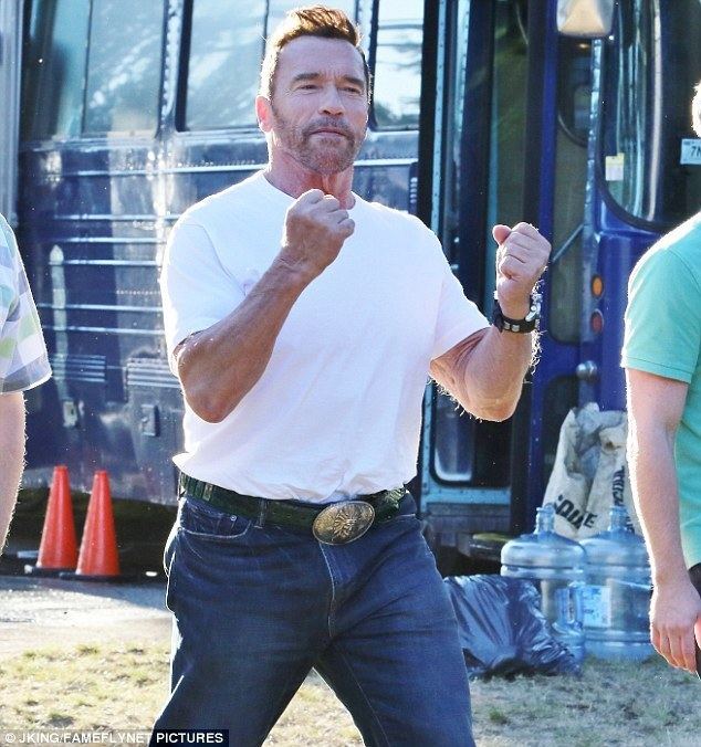 Why We're Killing Gunther Arnold Schwarzenegger sports youthful hairdo while filming with