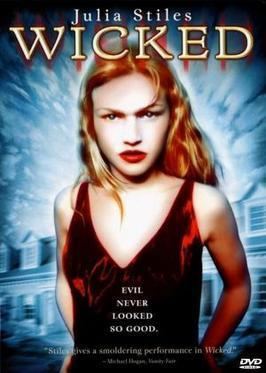A movie poster of the 1998 film "Wicked" featuring Julia Stiles in red dress
