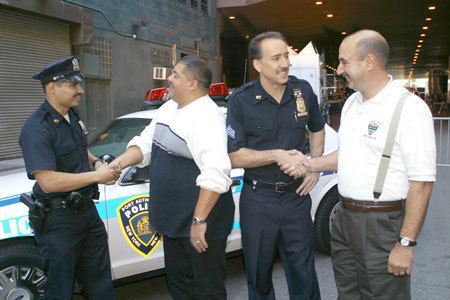 Will Jimeno portrayed by Michael Peña and John McLoughlin portrayed by Nicolas Cage in "World Trade Center", a 2006 American documentary drama disaster film.