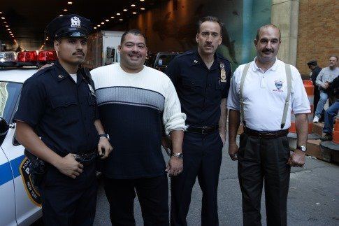 Will Jimeno portrayed by Michael Peña and John McLoughlin portrayed by Nicolas Cage in "World Trade Center", a 2006 American documentary drama disaster film.