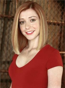 Willow Rosenberg smiling with blonde hair down and wearing a red blouse