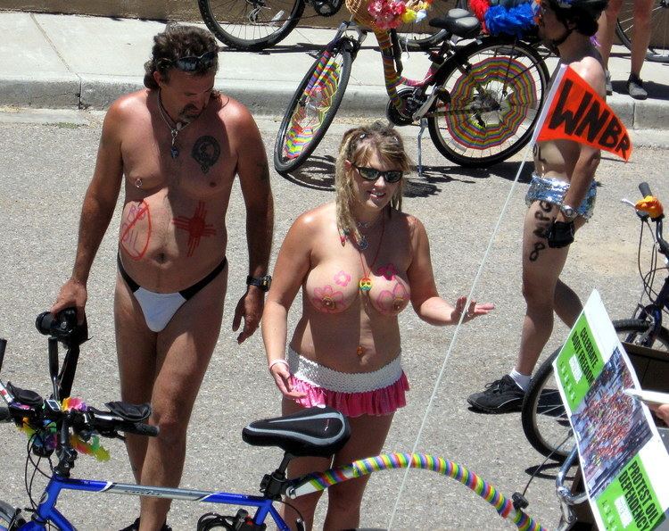 A man wearing a black and white panty and a woman wearing sunglasses and a white and pink skirt at World Naked Bike Ride, Santa Fe, 2010