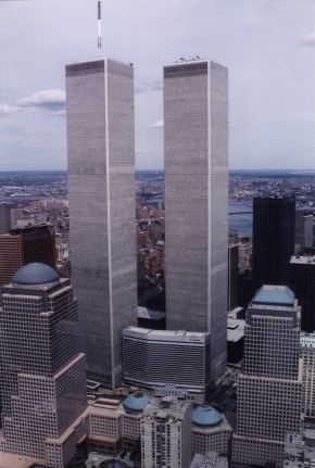 A picturesque view of Lower Manhattan which features the World Trade Center with the Twin Towers.