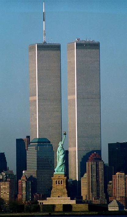 The Twin Towers in the World Trade Center as seen with the Statue of Liberty.