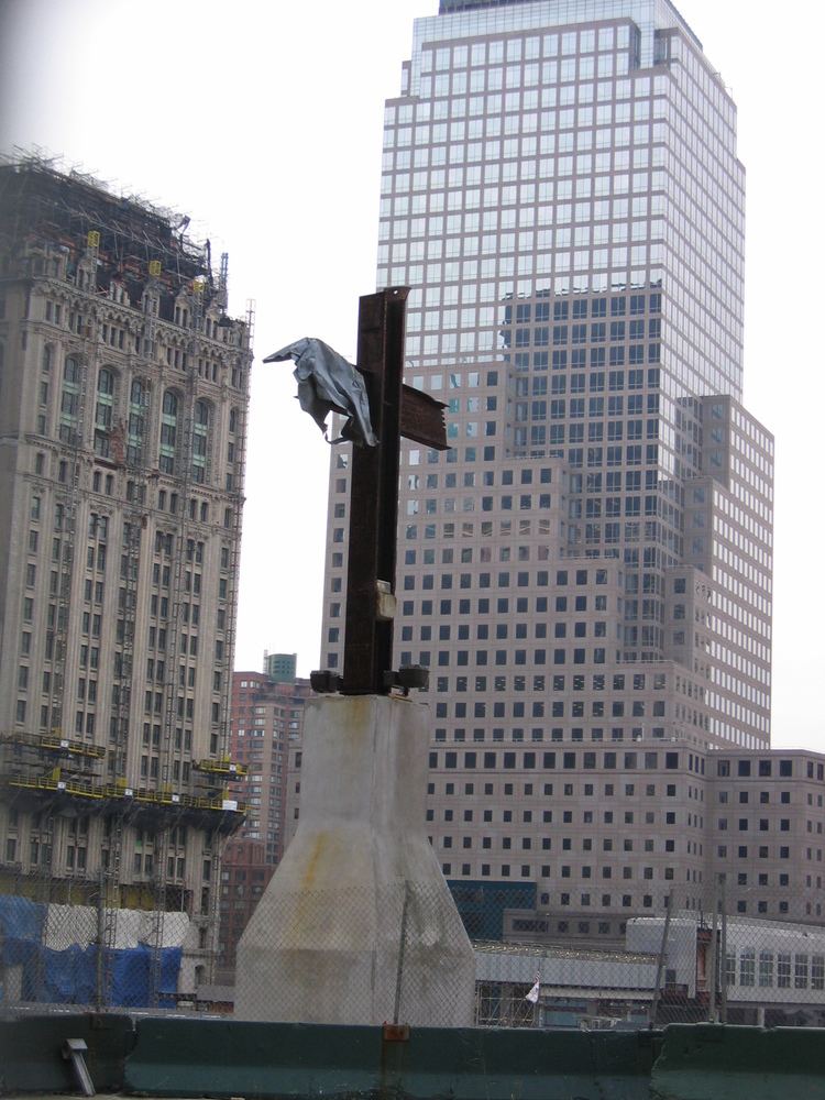The World Trade Center cross installed on a pedestal at Ground Zero