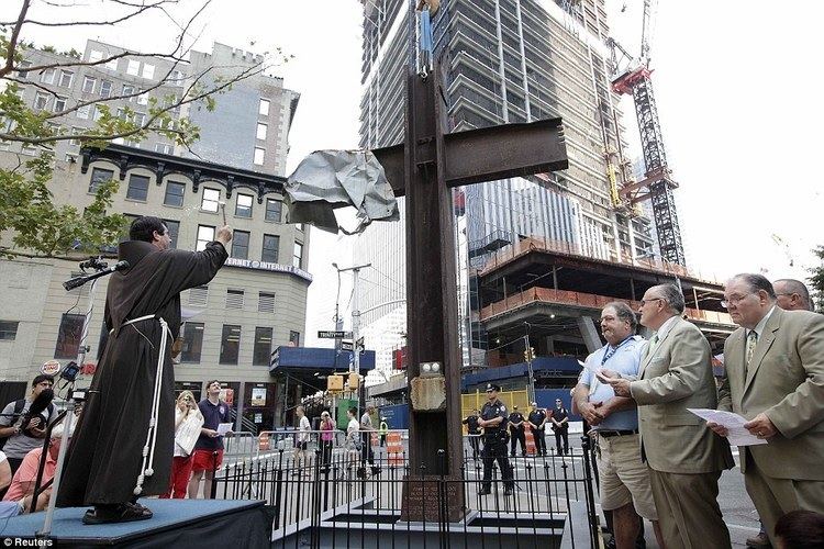 Father Brian Jordan, a Franciscan Priest, blesses The World Trade Center Cross that is made of intersecting steel beams
