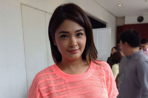 Yam Concepcion wearing pink-orange shirt