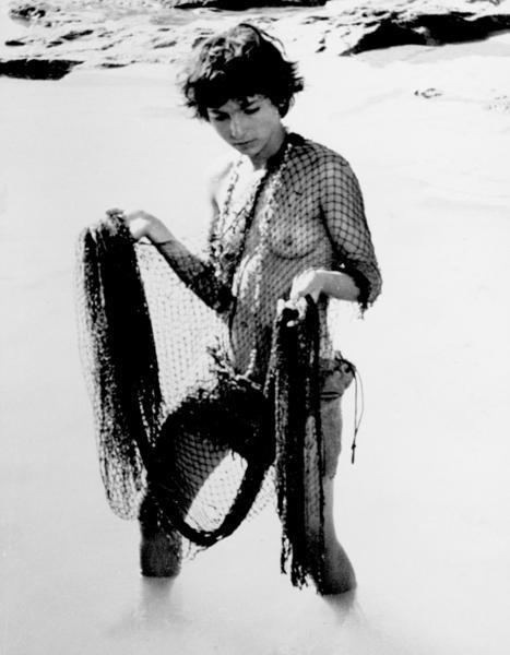 Cleopatra Rota clothing herself with a net exposing her private parts in the 1963 film "Young Aphrodites"