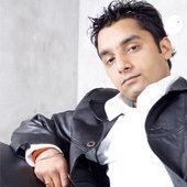 Yudhvir Manak wearing black leather jacket and white long sleeves