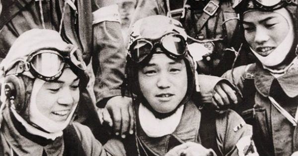 Yukio Araki 26 May 1945 Corporal Yukio Araki holding a puppy with four other