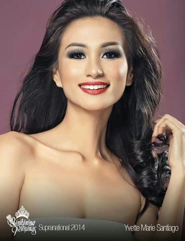 Yvethe Marie Santiago with a big smile and long black wavy hair while wearing a white tube top. On the bottom left, is the Binibining Pilipinas logo with Supranational 2014 and on the bottom right, is her name
