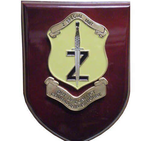Z Special Unit badge with written quote "out of conflict comradship is borne"