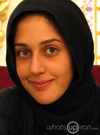 Zahra Amir Ebrahimi smiling and wearing a black hijab