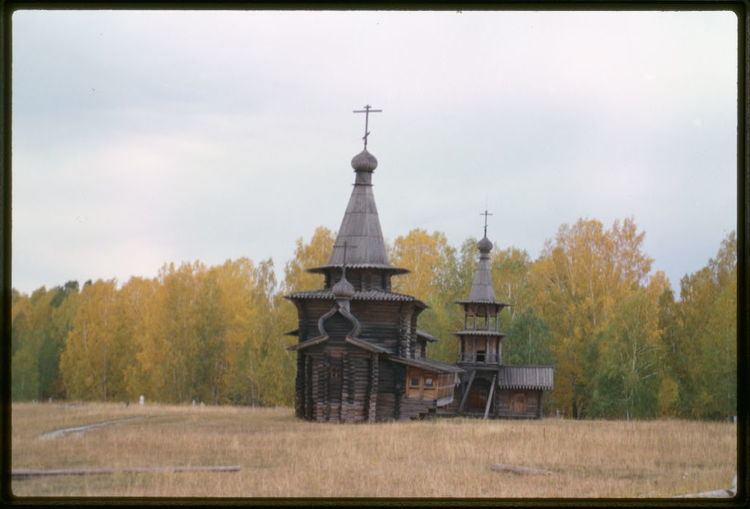 Zashiversk Log Church of the Savior and bell tower from the village of