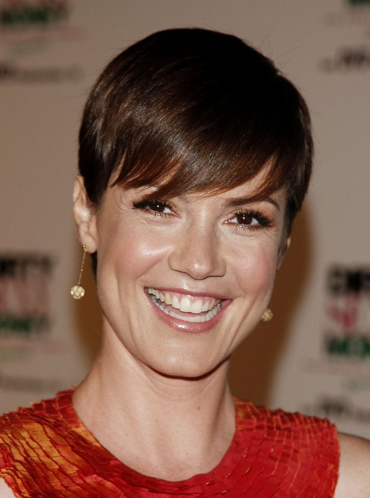 Zoe McLellan laughing while wearing red top